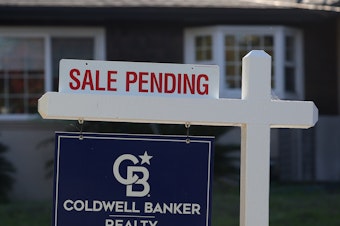caption: A "sale pending" sign is posted in front of a home for sale on November 30, 2023 in San Anselmo, Calif.  Realtors face lower commissions after a major settlement upended the way  Americans buy and sell homes.