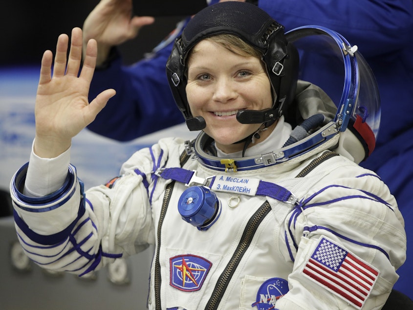 caption: While she was working last week, U.S. astronaut Anne McClain realized that her suit was too big to maneuver in comfortably.
