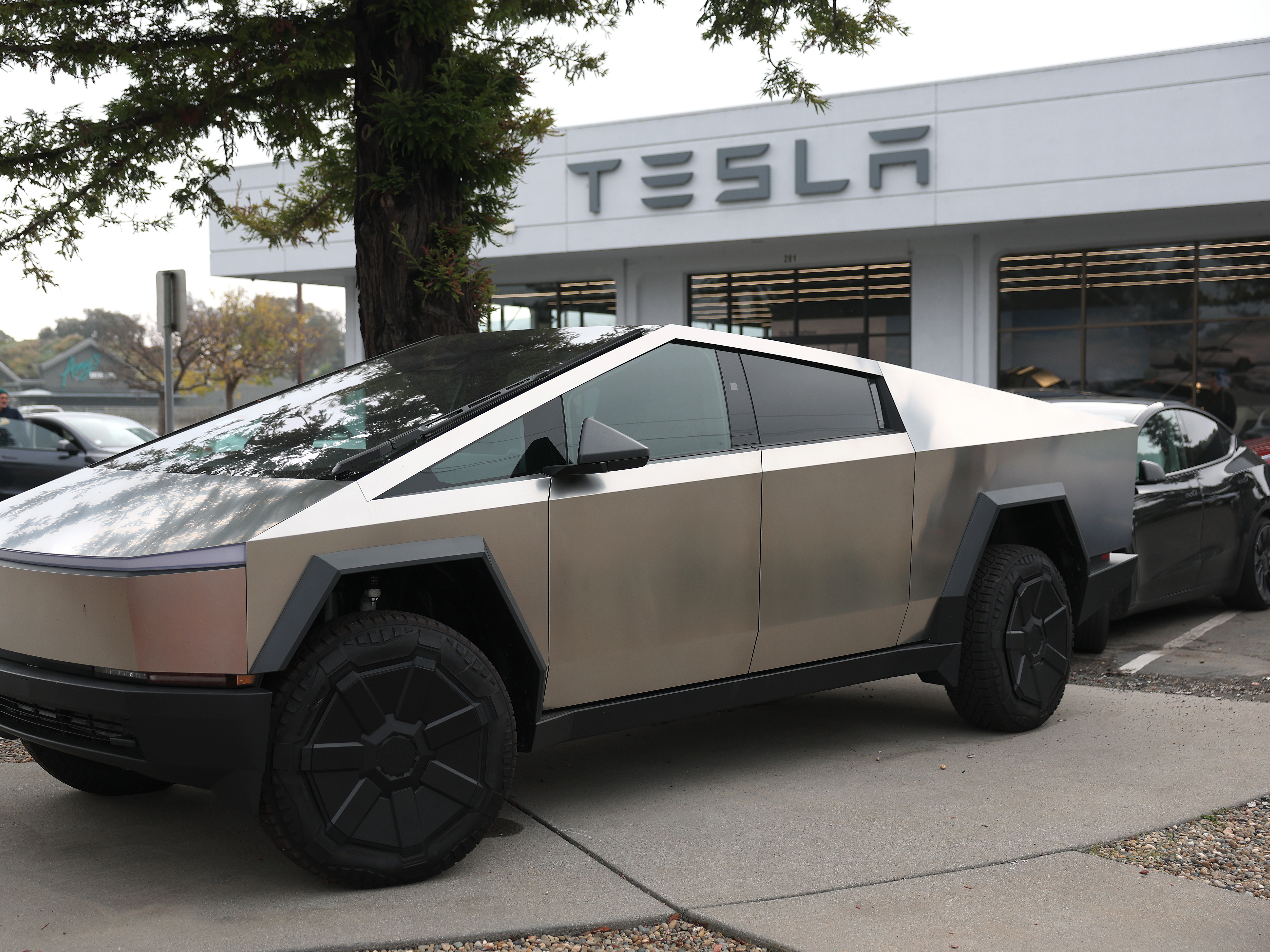 caption: A Tesla Cybertruck at a Tesla dealership on Dec. 20, 2024 in Corte Madera, Calif. A State Department procurement document suggested the Trump administration planned to buy $400 million worth of Tesla vehicles to transport diplomats. The administration now says no such purchase is planned.