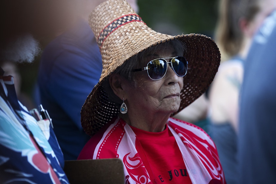 caption: Cecile Hansen, chair of the Duwamish Tribal Council, attends a gratitude gathering for Luma, a roughly 200-year-old culturally modified cedar tree at risk of being cut down for a development project, on Tuesday, July 18, 2023, in the Wedgwood neighborhood of Seattle.