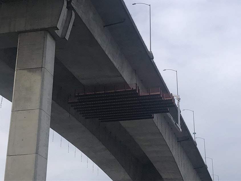 caption: A work platform under the West Seattle Bridge as crews work to repair cracks in the bridge. 