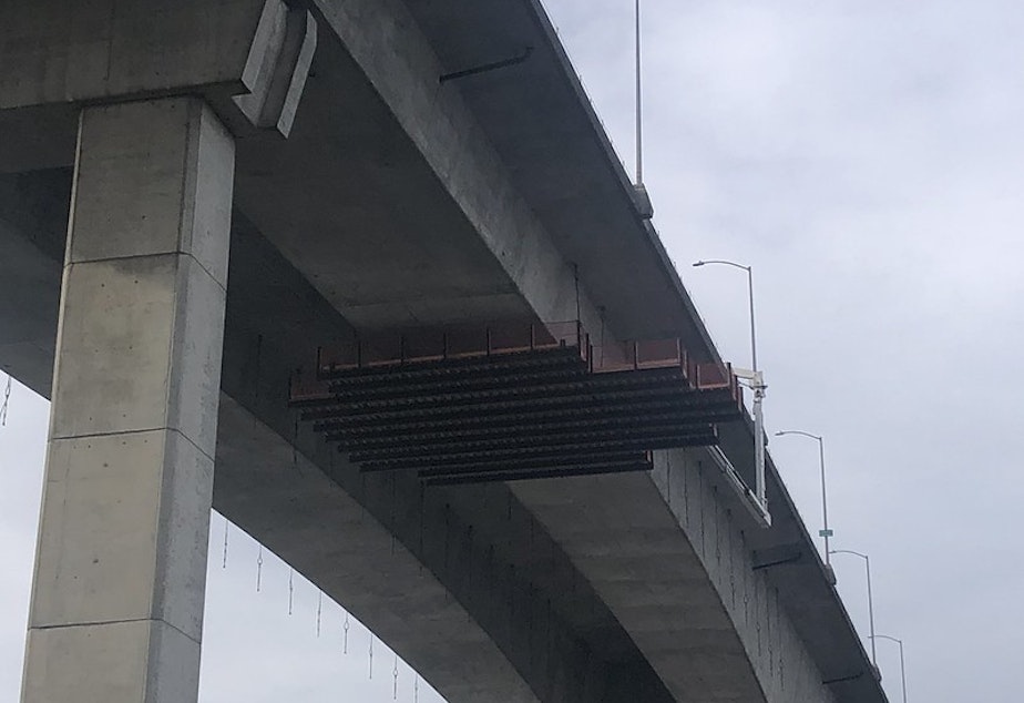 caption: A work platform under the West Seattle Bridge as crews work to repair cracks in the bridge. 