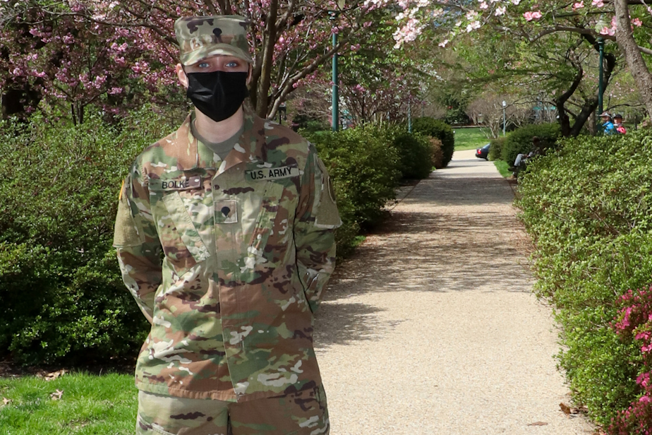 caption: U.S. Army Spc. Jillian Bolke, 2nd Battalion, 146th Field Artillery Regiment, Washington National Guard, poses for a photo near the U.S. Capitol grounds in Washington, D.C., April 10, 2021. 