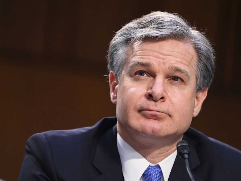caption: FBI Director Christopher Wray testifies on Tuesday before the Senate Judiciary Committee about the Jan. 6 insurrection at the Capitol.