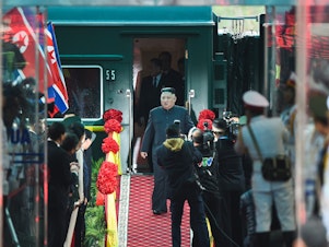 caption: Kim Jong Un steps off his train in 2019 ahead of the U.S.-North Korea summit.