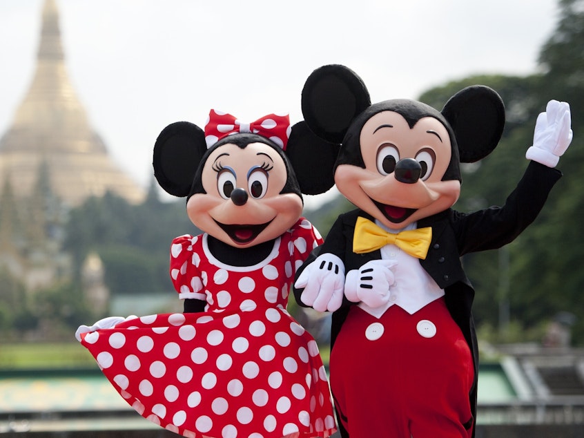 Walt Disney characters Mickey Mouse and Minnie Mouse pose for photographs