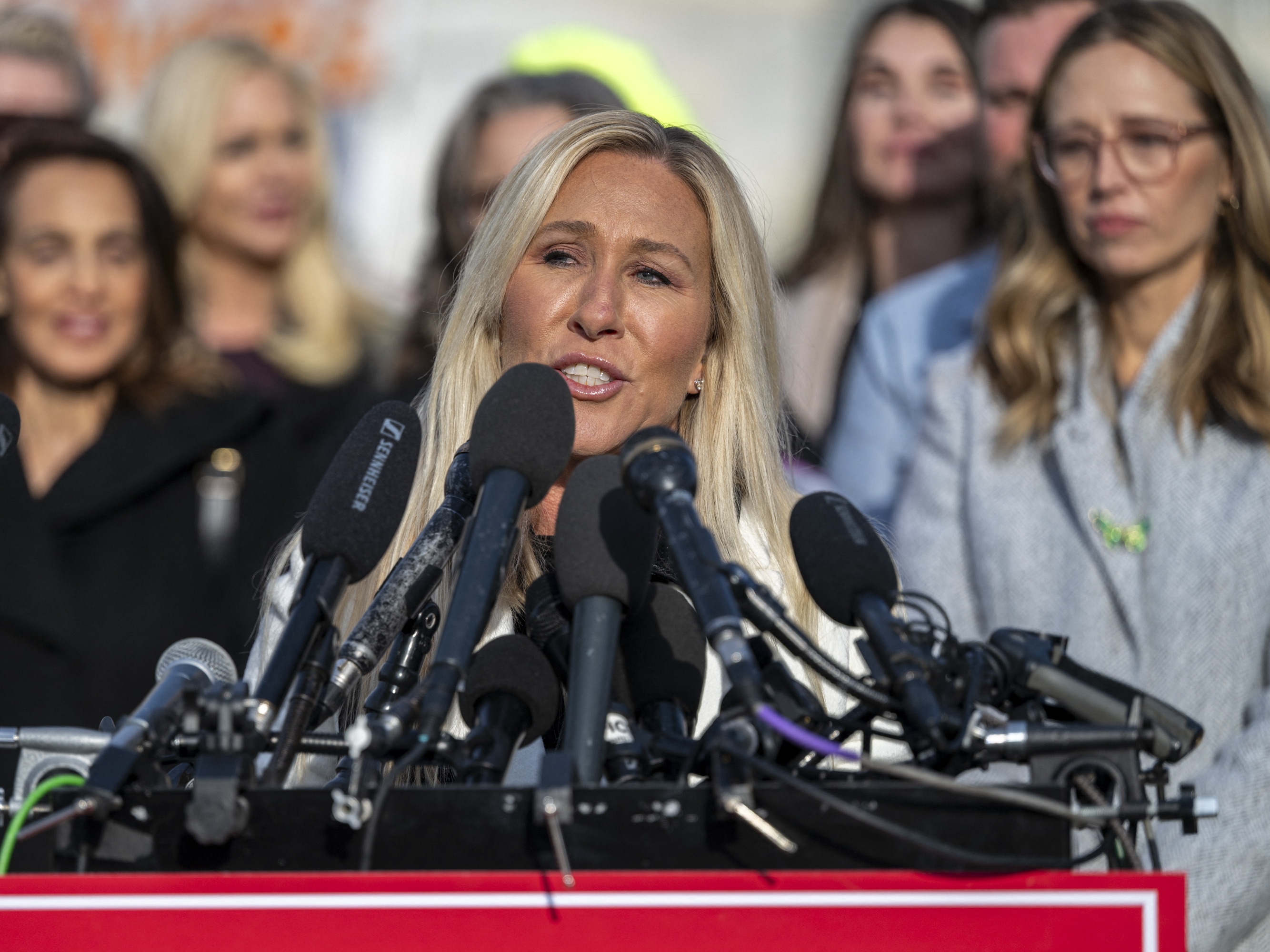 caption: Rep. Marjorie Taylor Greene, R-Ga., speaks during a press conference outside the U.S. Capitol on Tuesday.