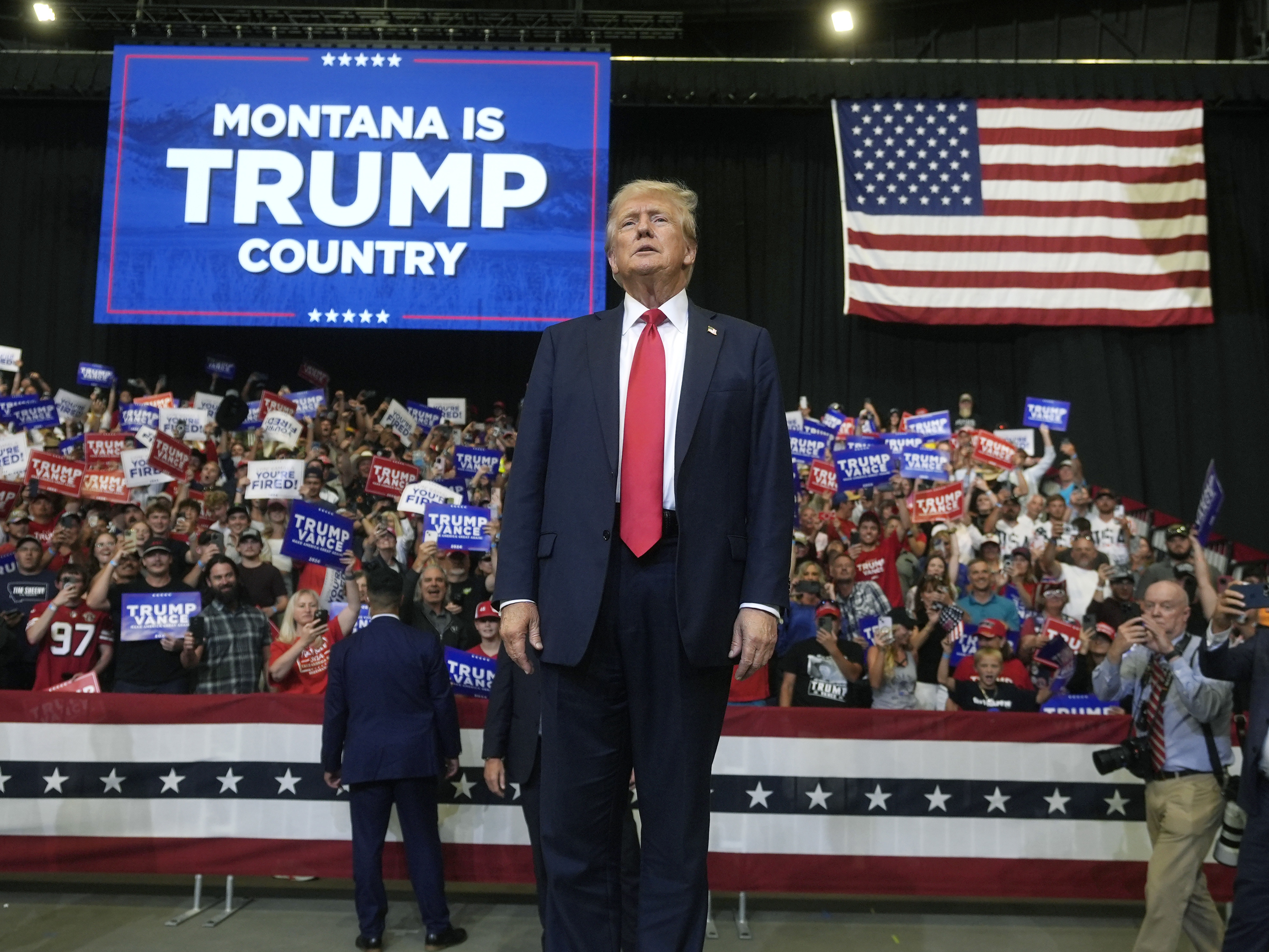 caption: Former President Donald Trump arrives for a campaign rally in Bozeman, Mont., on Friday, Aug. 9.