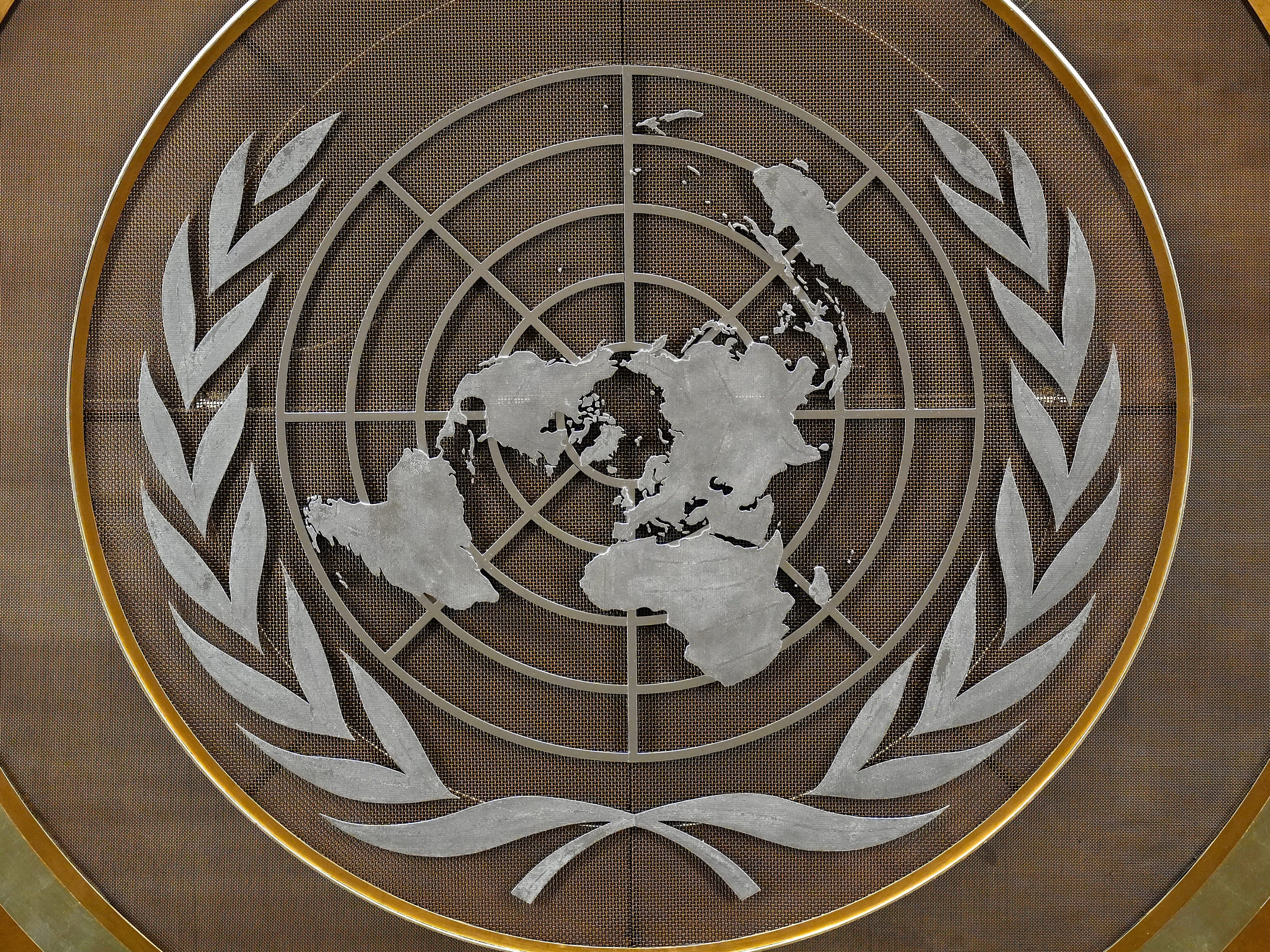 caption: FILE - The United Nations logo is seen inside the 79th session of the United Nations General Assembly, Tuesday, Sept. 24, 2024.