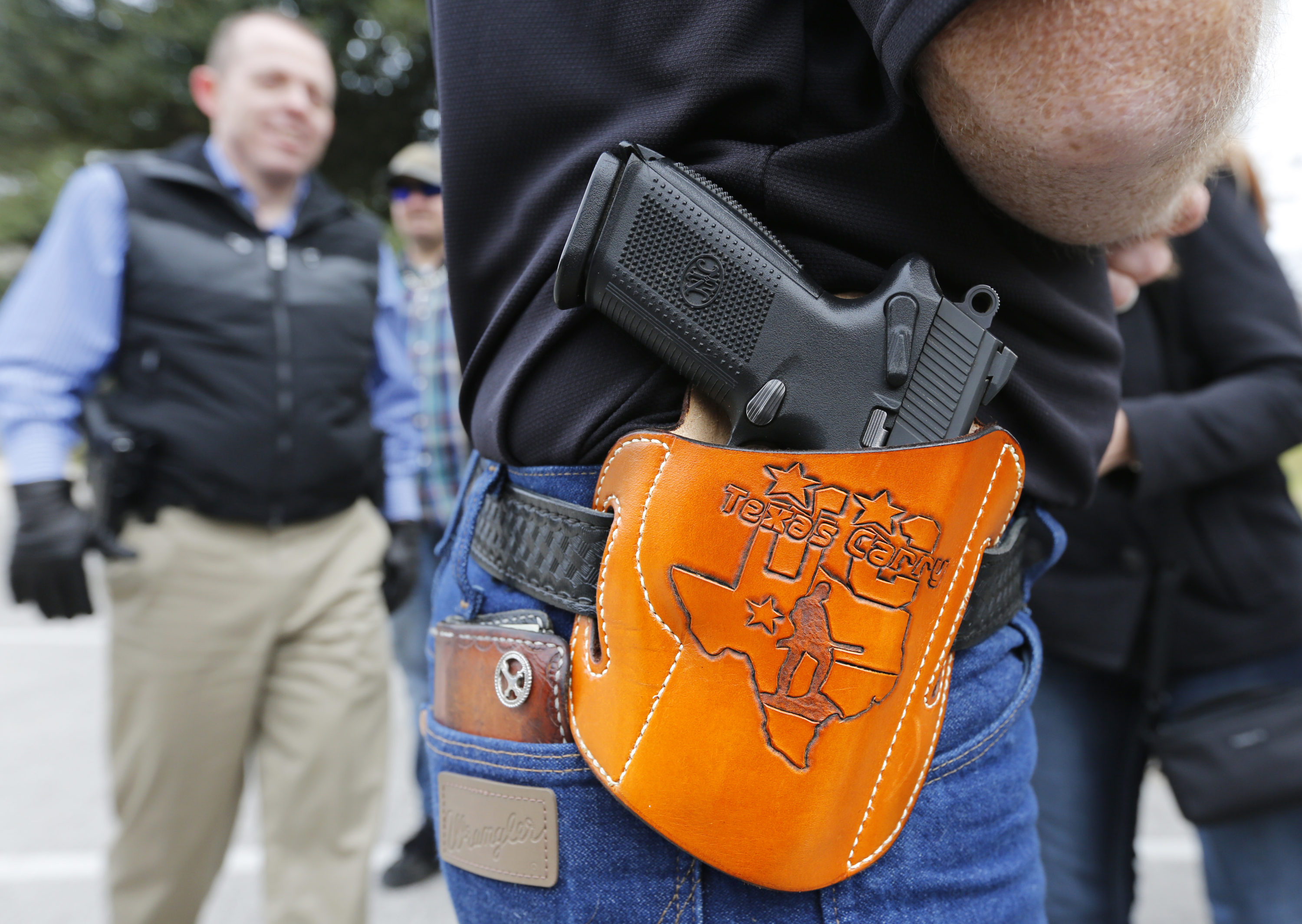 caption: 2nd Amendment activists at an open carry rally at the Texas state capitol on Jan. 1, 2016 in Austin, Texas. (Erich Schlegel/Getty Images)