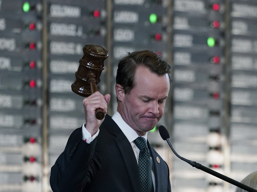 caption: Texas Republican House Speaker Dade Phelan strikes his gavel as the House votes on an amendment to election bill SB1 on Thursday. The legislation easily passed in the GOP-led chamber.