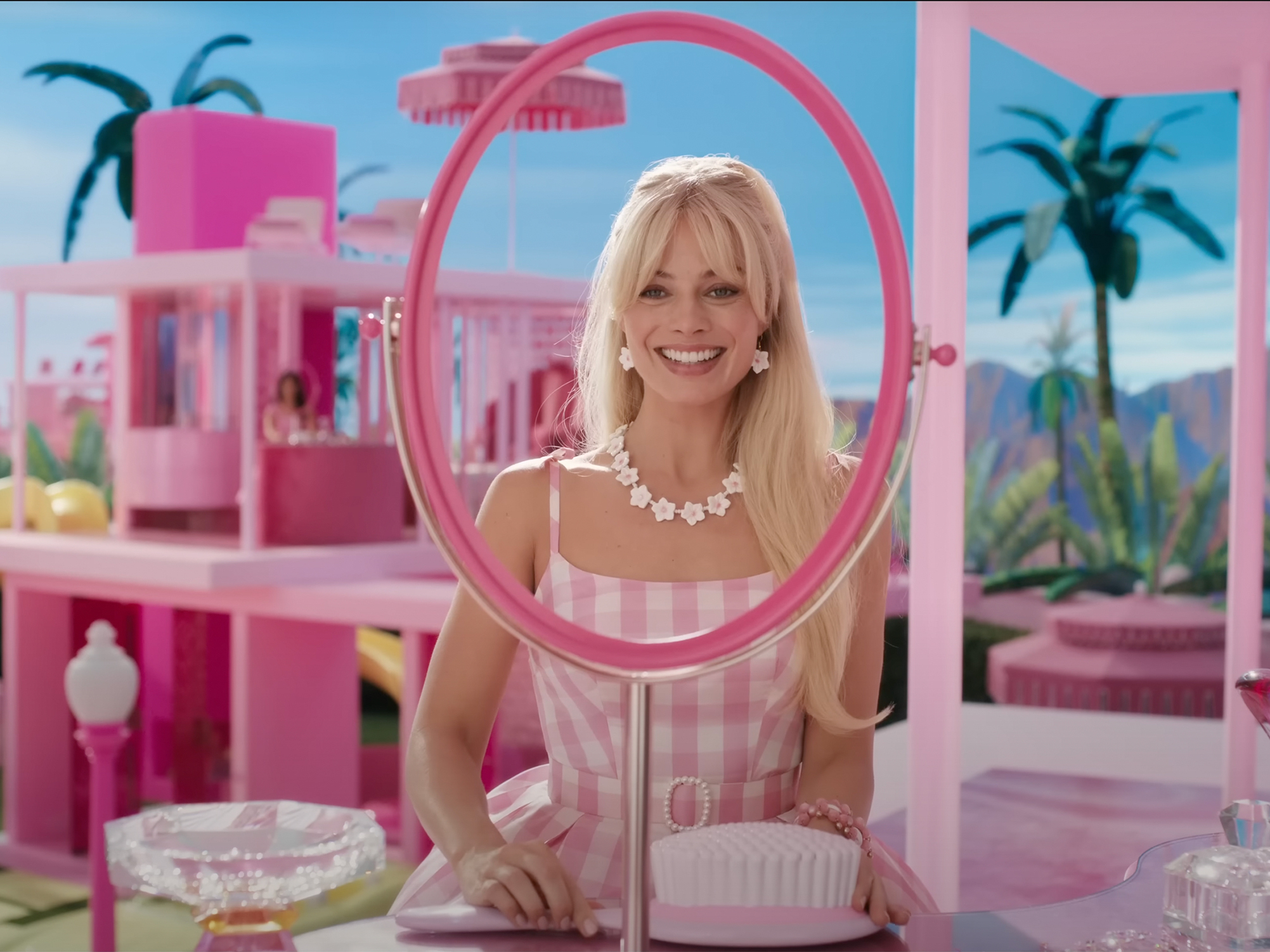 caption: Margot Robbie stars in the live-action <em>Barbie</em> movie, whose production reportedly required jaw-dropping amounts of pink paint.