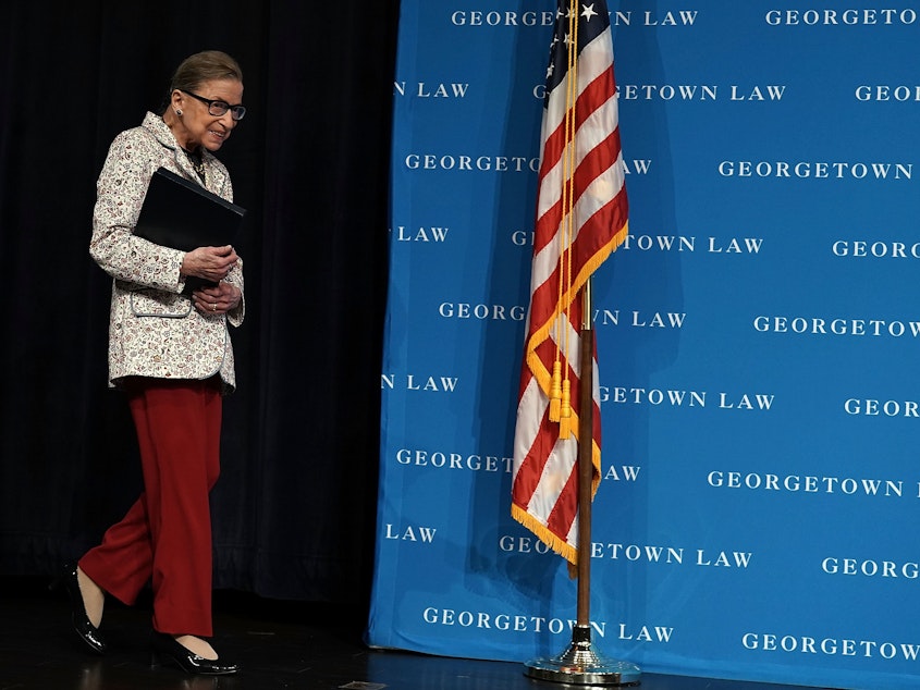 caption: U.S. Supreme Court Justice Ruth Bader Ginsburg arrives at a lecture on Sept. 26 at Georgetown University Law Center in Washington, D.C. Ginsburg has been hospitalized after falling and fracturing several ribs.