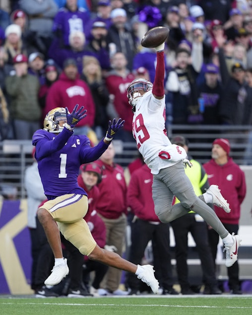 caption: Washington State defensive back Jamorri Colson swats away a pass meant for Washington wide receiver Rome Odunze during the first half of an NCAA college football game, Saturday, Nov. 25, 2023, in Seattle.
