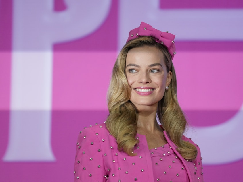 caption: Margot Robbie poses for the media prior to a news conference of the movie <em>Barbie</em> in Seoul, South Korea, Monday. The film is to be released in the country on July 19.