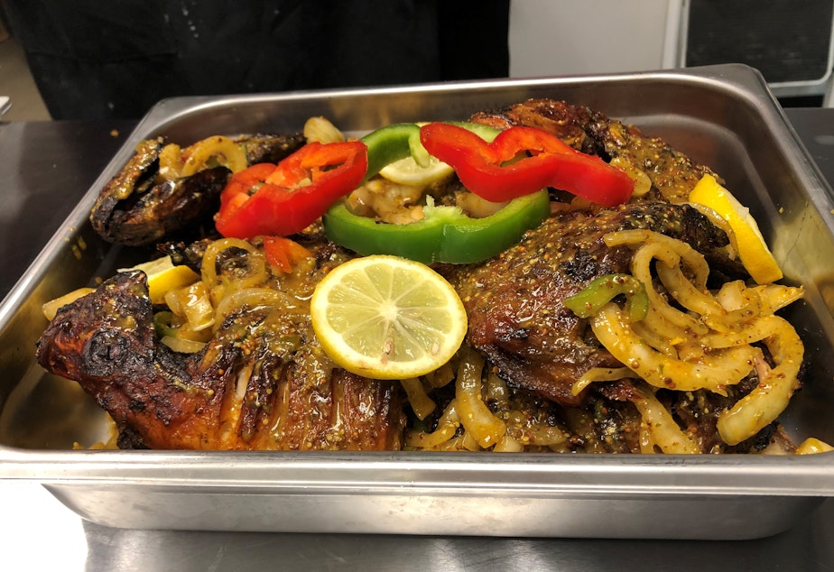 caption: Fish Yassa, a traditional dish from Gambia. 
