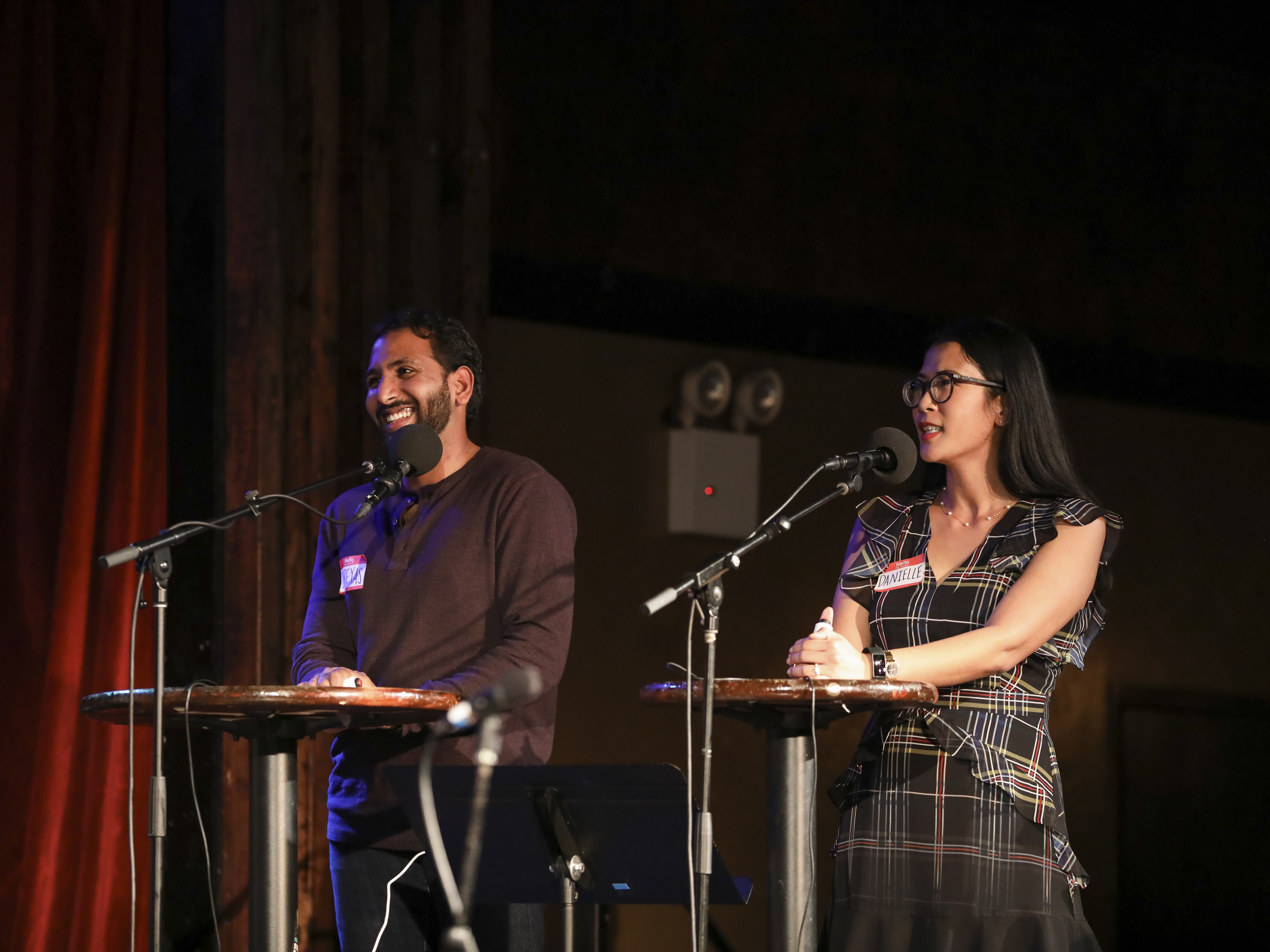 caption: Shreyas Vangala and Danielle Mebert go head-to-head in <em>Ask Me Another</em>'s Tournament of Champions at the Bell House in Brooklyn, New York.