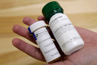 caption: Bottles of abortion pills mifepristone, left, and misoprostol, right, at a clinic in Des Moines, Iowa, Sept. 22, 2010. In the U.S., medication abortions usually involve the drugs mifepristone and misoprostol. 