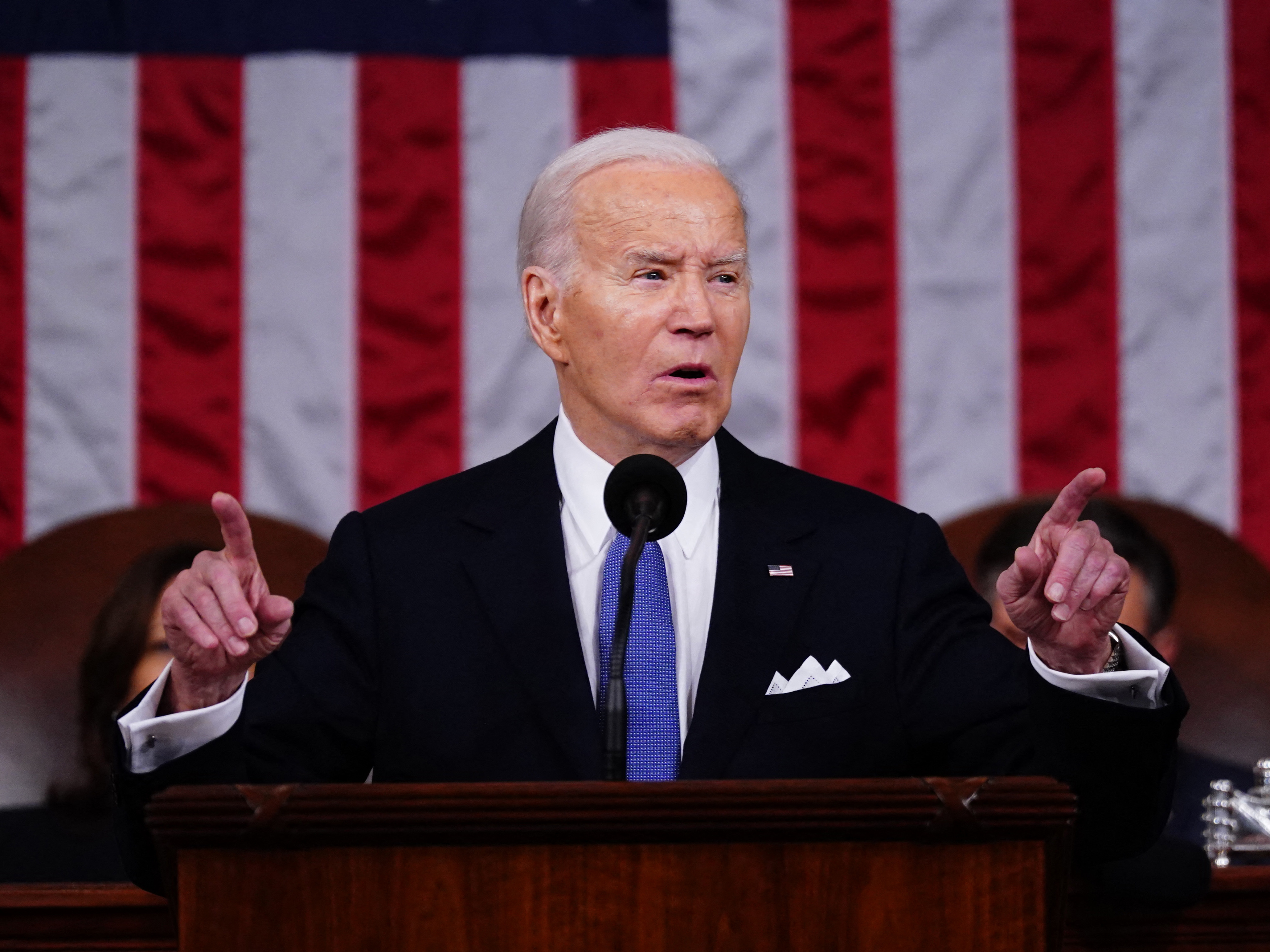 caption: President Biden delivers the State of the Union address in the House chamber of the Capitol in Washington, D.C., on March 7.