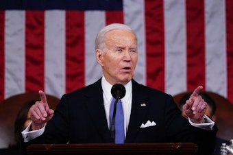 caption: President Biden delivers the State of the Union address in the House chamber of the Capitol in Washington, D.C., on March 7.