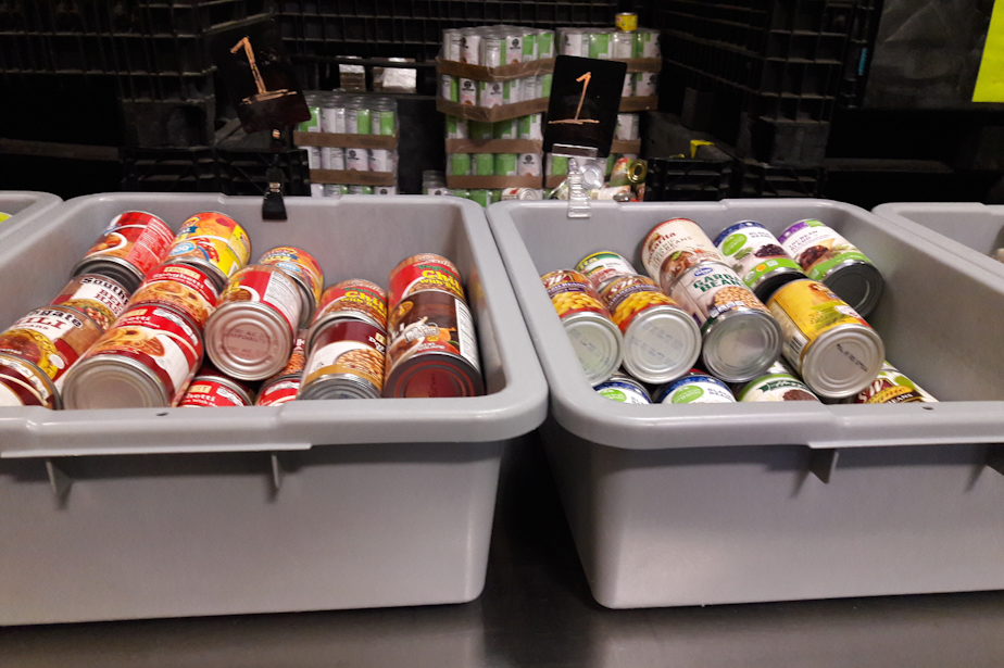 caption: Cans of food at the Ballard Food Bank. 