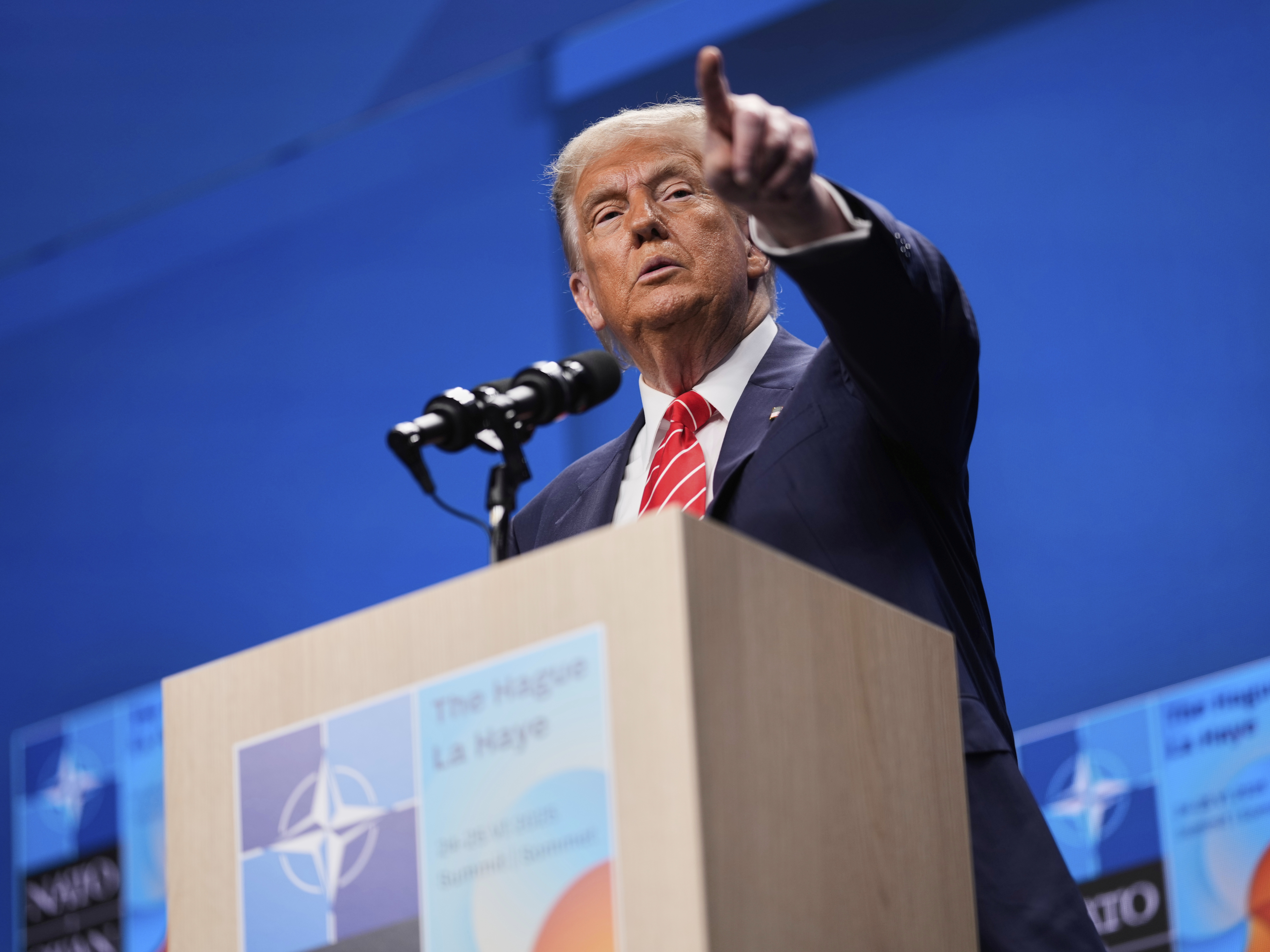 caption: President Trump speaks during a media conference at the NATO summit in The Hague, Netherlands on June 25.