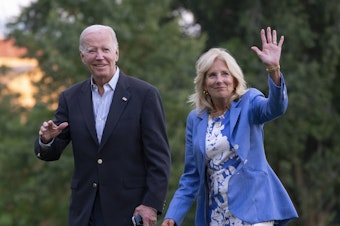 caption: President Joe Biden and first lady Jill Biden wave as they arrive at the White House, Saturday, Aug. 26, 2023, in Washington after a vacation in Lake Tahoe.