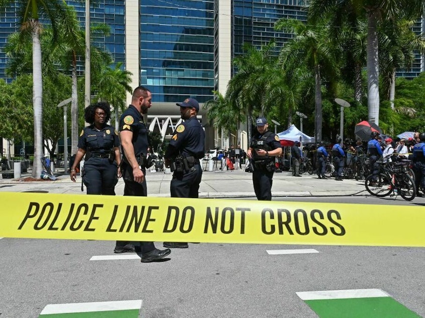 caption: Police officers are pictured outside the Wilkie D. Ferguson Jr. United States Courthouse before the arraignment of former President Donald Trump in Miami on Tuesday.