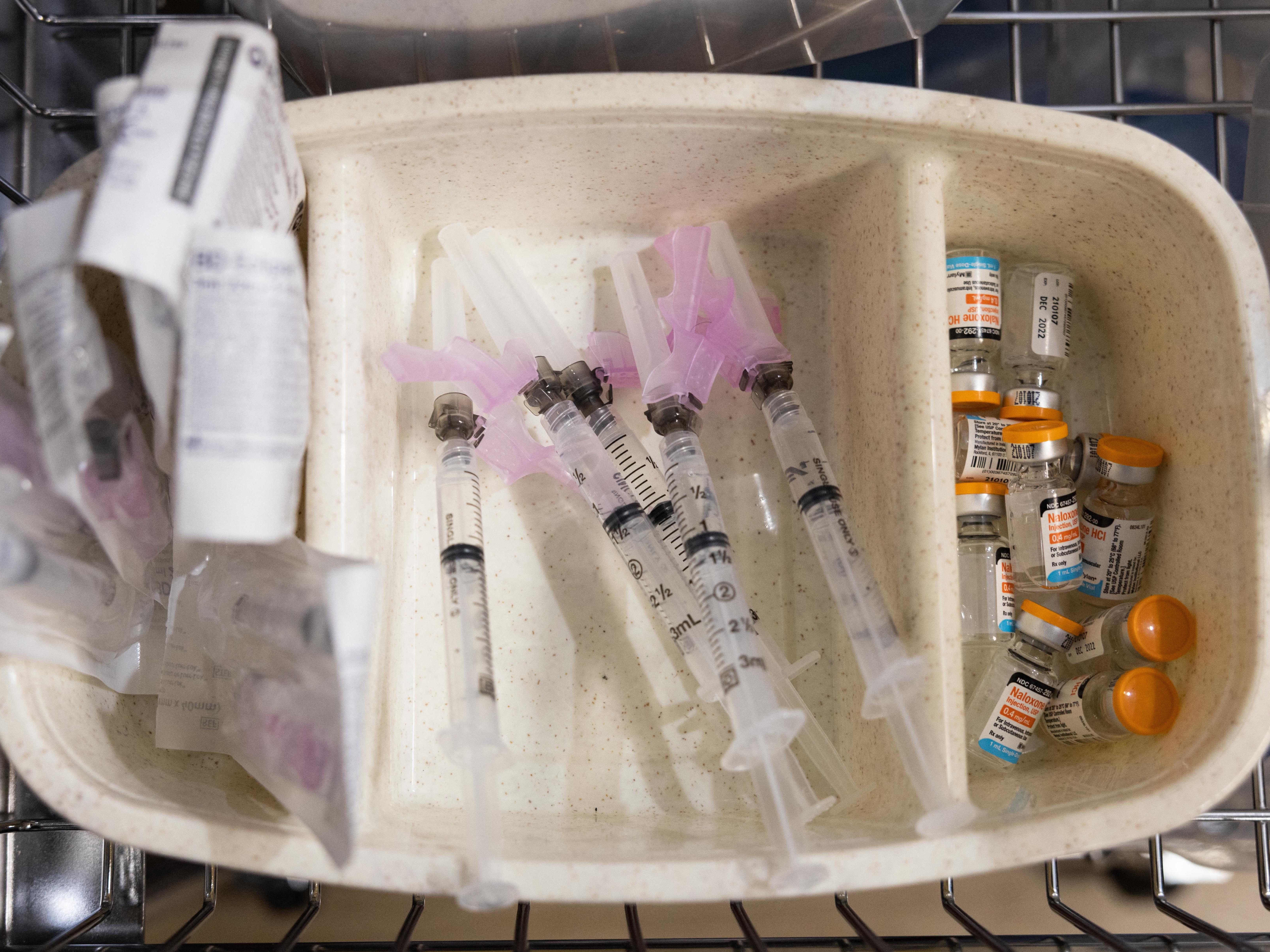 caption: In this Nov. 30, 2021, photo, syringes and vials of Naloxone are shown during the media tour of the supervised drug injection site OnPoint, in New York.