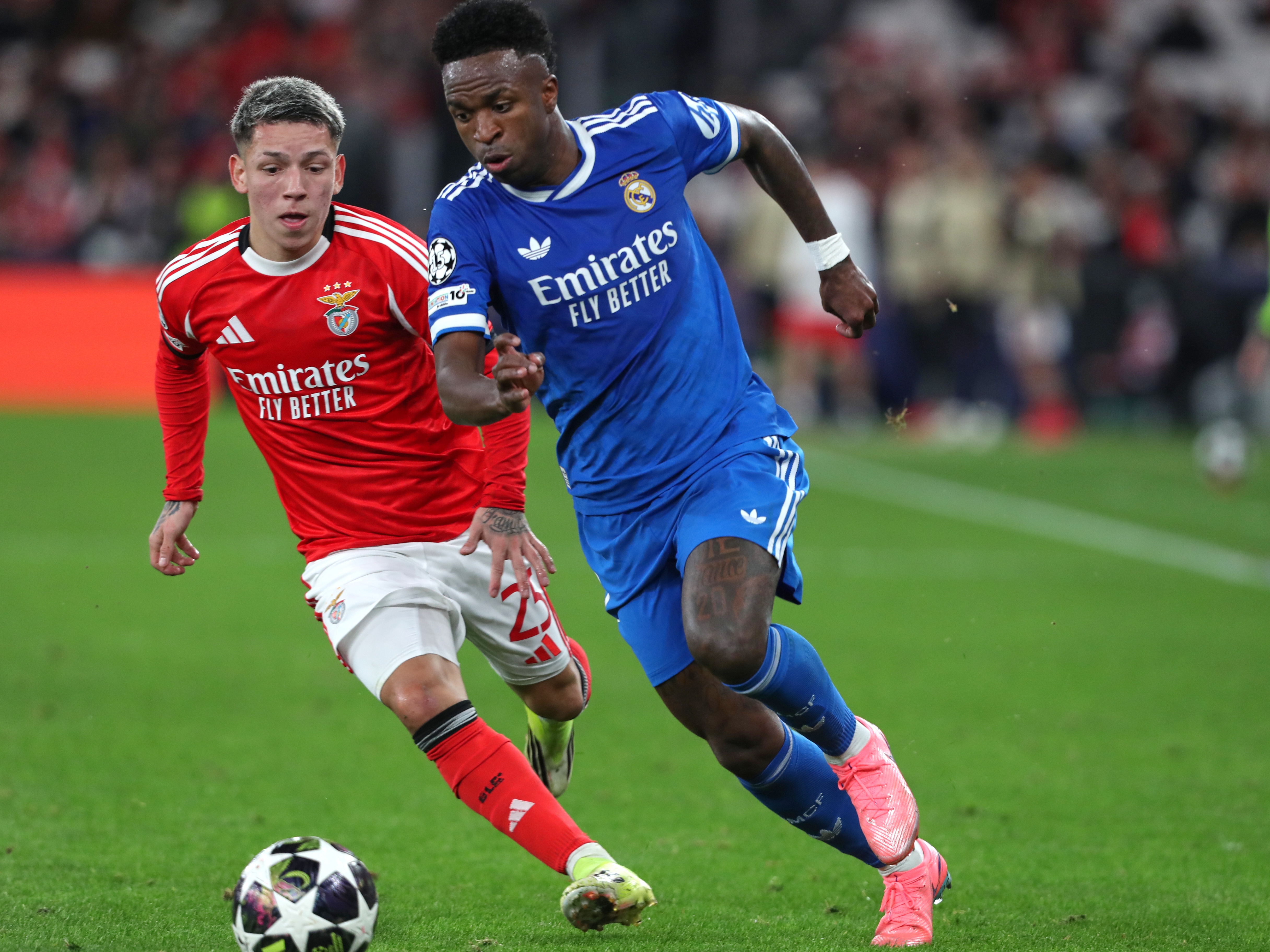 caption: Benfica's Gianluca Prestianni fights for the ball against Real Madrid's Vinicius Junior during a Champions League playoff soccer match between SL Benfica and Real Madrid in Lisbon, Portugal, Tuesday, Feb. 17, 2026.