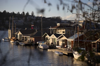 caption: Houseboats are lined up on Tuesday, January 30, 2018, off of Fairview Avenue East in Seattle.