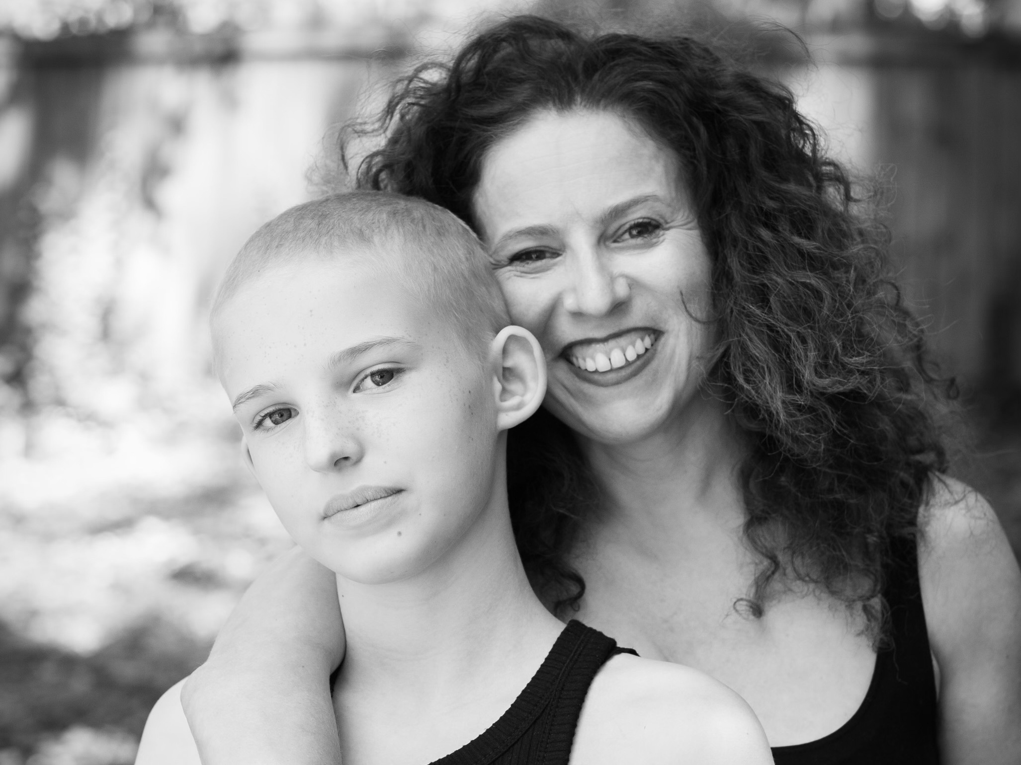 caption: Sarah Wildman and Orli, photographed in early summer 2021. Orli was finishing a second round of chemotherapy after her liver cancer had metastasized when she was asked to participate in a project chronicling the beauty of baldness.