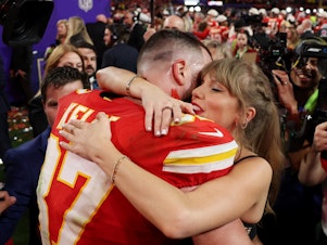 caption: Travis Kelce of the Kansas City Chiefs embraces Taylor Swift after defeating the San Francisco 49ers during this year's Super Bowl in Las Vegas. Swift, who flew in from Tokyo to attend the game, jokingly told him, "jet lag is a choice."