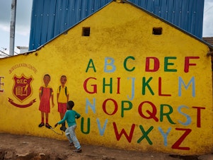 caption: In his new book for young teenagers, Charles Kenny points out signs of global progress, including the growing number of kids in school. Above: The Oloo Education Center aims to provide an education to kids in Kibera, a poor community in Nairobi, Kenya. When you type "Kibera" into the Uber app, it comes up as "Kibera slum."