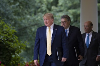 caption: President Trump arrives at the White House with Commerce Secretary Wilbur Ross (right) and U.S. Attorney General William Barr in July to speak about Trump's executive order concerning citizenship.