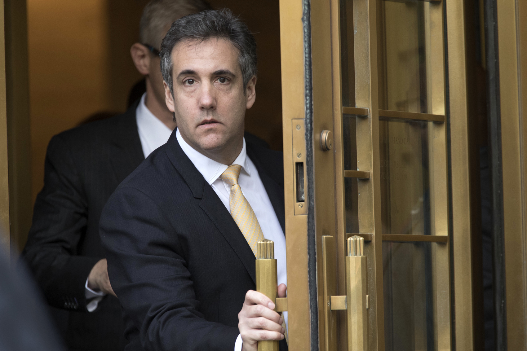 caption: Michael Cohen, former personal lawyer to President Donald Trump, leaves Federal court, Tuesday, Aug. 21, 2018, in New York. (Mary Altaffer/AP)