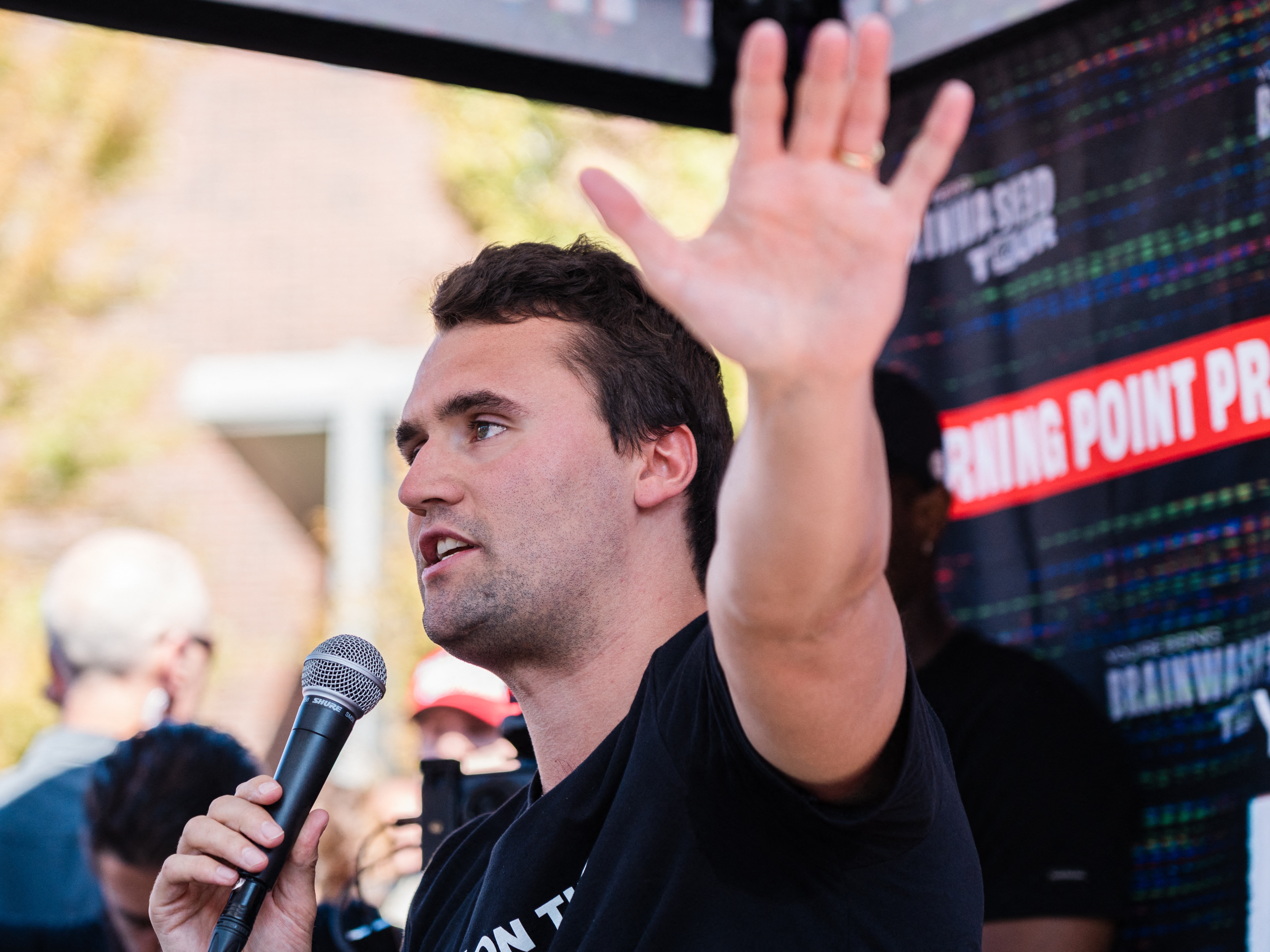 caption: U.S. conservative political activist Charlie Kirk speaks at University of Nevada in Reno on Oct. 8, 2024. (Photo by / AFP) (Photo by ANDRI TAMBUNAN/)