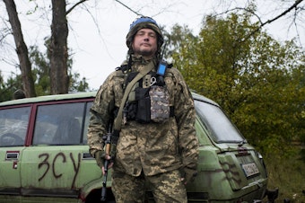 caption: A soldier who was formerly an IT entrepreneur and asked to be identified only by his call sign "Arun" manning a checkpoint in Borshchova, in northeastern Ukraine, on Friday. Ukrainian troops took back the area from Russian forces earlier this month.