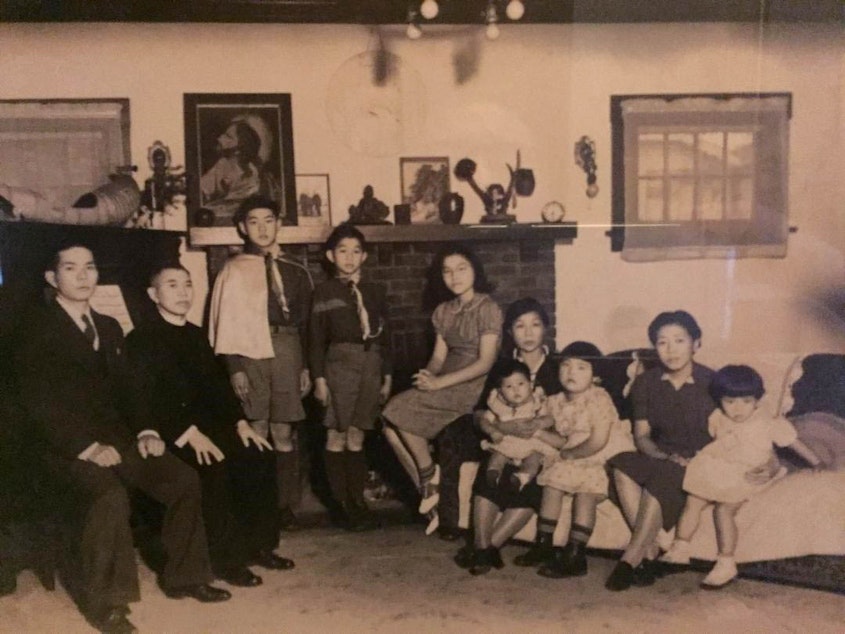 caption: From left: Unknown male, Gennosuke Shoji, Joseph Shoji, Sam Shoji, Elizabeth Shoji, Kane Shoji holding unknown child, Florence Shoji.
