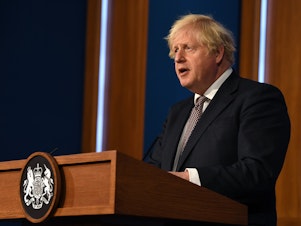 caption: Britain's Prime Minister Boris Johnson gives an update on relaxing restrictions imposed on the country during pandemic at a virtual press conference at Downing Street on July 5.