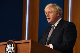 caption: Britain's Prime Minister Boris Johnson gives an update on relaxing restrictions imposed on the country during pandemic at a virtual press conference at Downing Street on July 5.