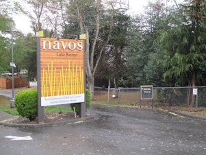 caption: Sign for Navos' Ruth Dykeman Children's Center in Burien, Wash.
