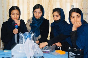 caption: Elham Mansori, Florence Poya, Nahida Khajazadeh and Somaya Farooqi, members of the Afghan Dreamers, are building a mechanized version of the hand-operated ventilator.