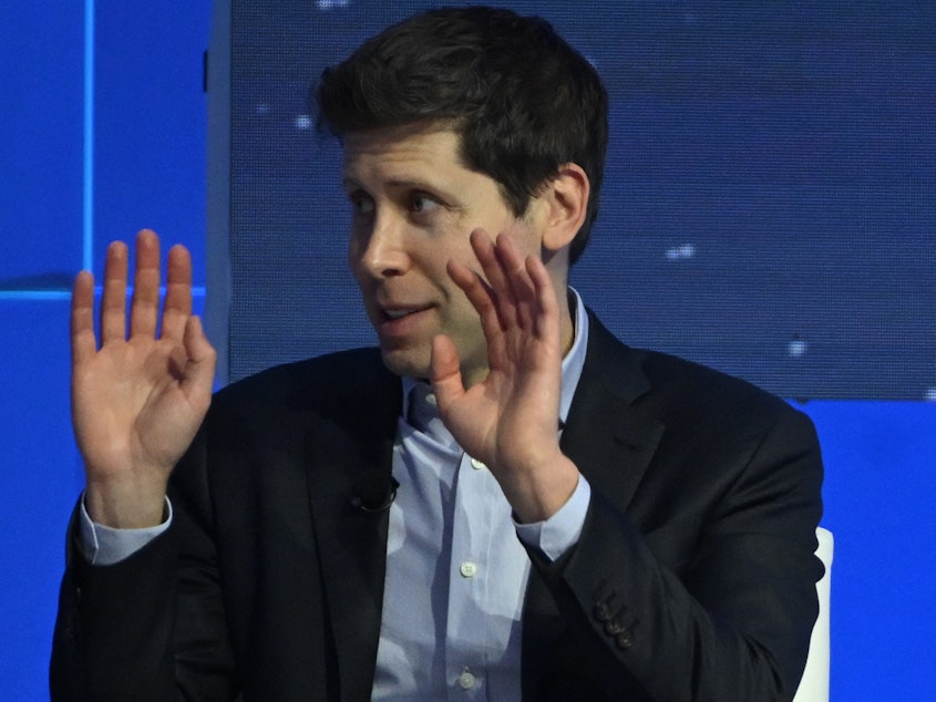 caption: Sam Altman is shown at a panel discussion on artificial intelligence" at the Asia-Pacific Economic Cooperation (APEC) summit in San Francisco, California, on Nov. 16, 2023.