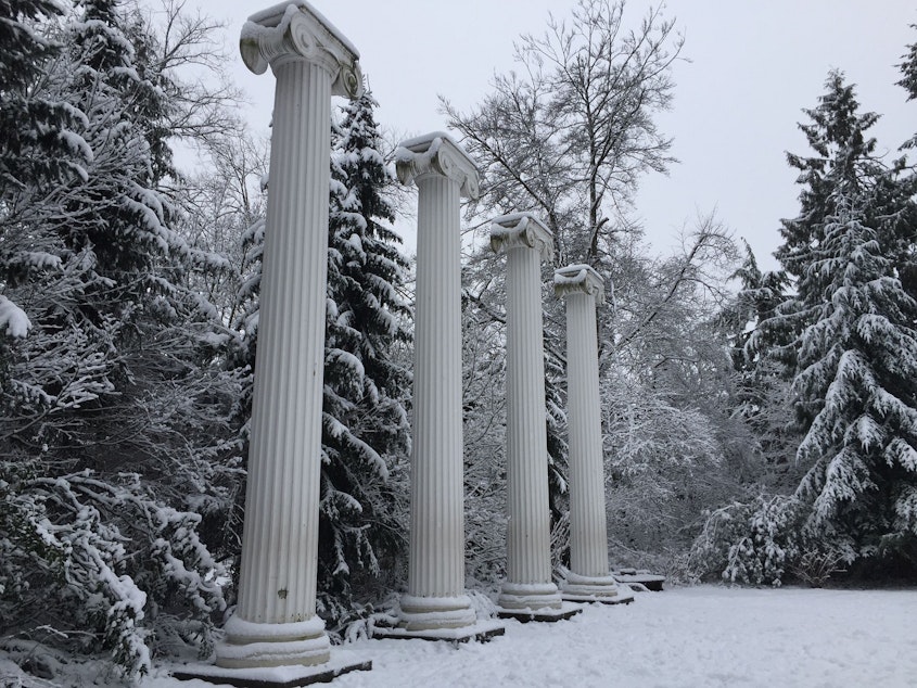 caption: Pillars and snow in the University District on Saturday, Feb. 9, 2019.