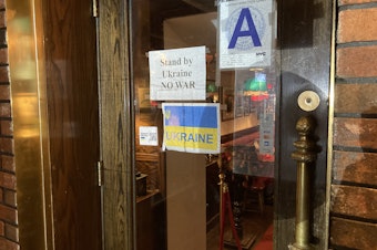 caption: After the invasion, The Manhattan restaurant Russian Samovar posted signs showing support for Ukraine.