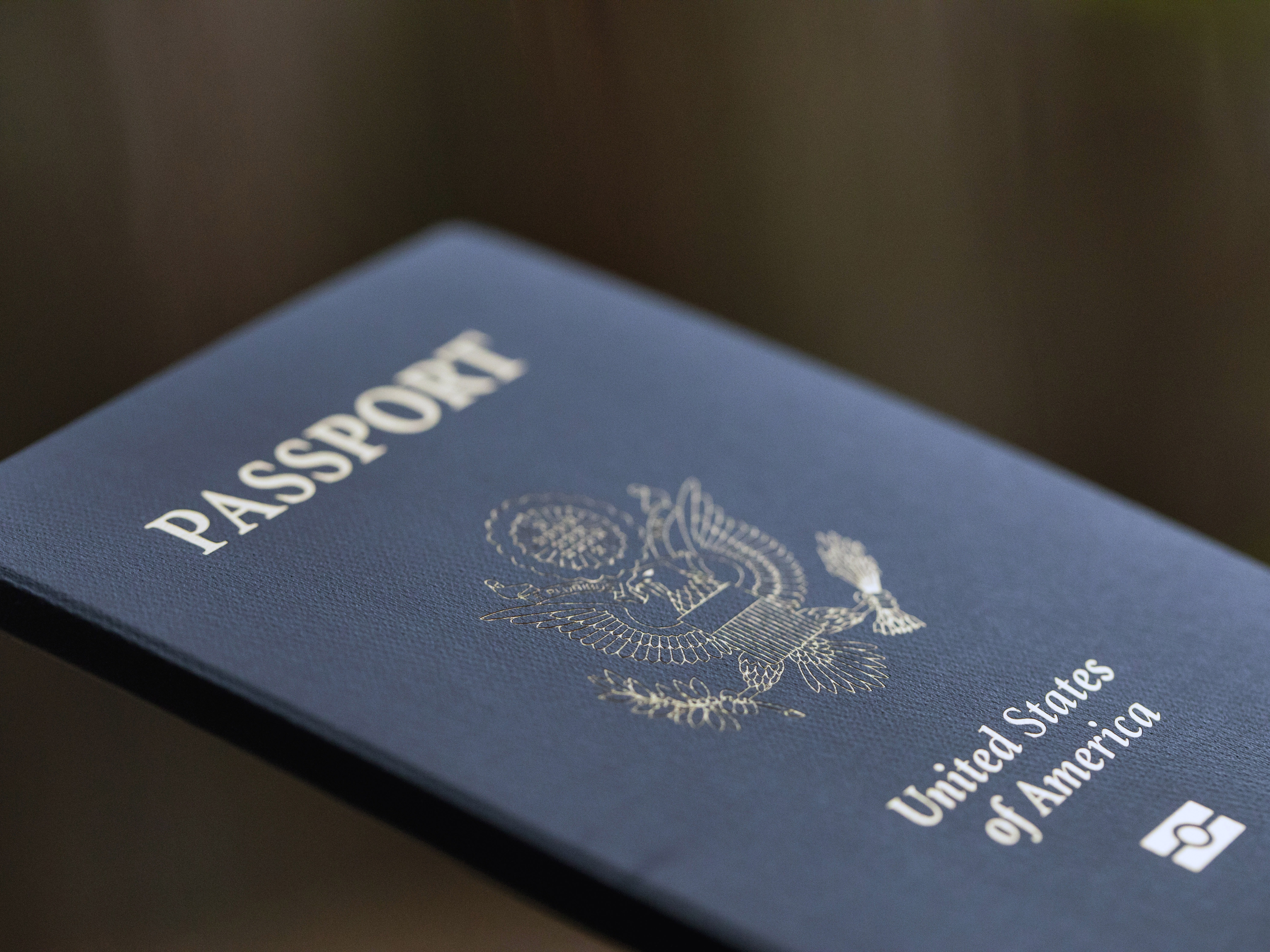 caption: The cover of a U.S. Passport is displayed in Tigard, Ore., Dec. 11, 2021. Americans can now renew their passports online, bypassing a cumbersome mail-in paper application process that often caused delays. The State Department announced Wednesday that its online passport renewal system is now fully operational. 