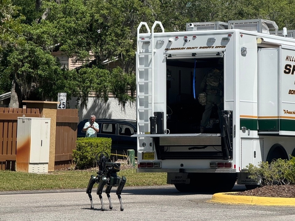 caption: The Hillsborough County Sheriff's Office responds to a neighborhood close to the University of South Florida campus, Friday, April 24, 2026 in Tampa, Fla.