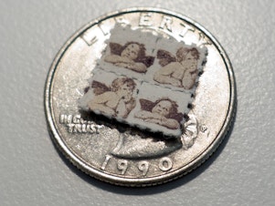 caption: LSD blotter tabs sit on top of a US quarter coin. A drug based off of psychedelic LSD appears to relieve depression and anxiety in mice, but without the hallucinogenic side effects.