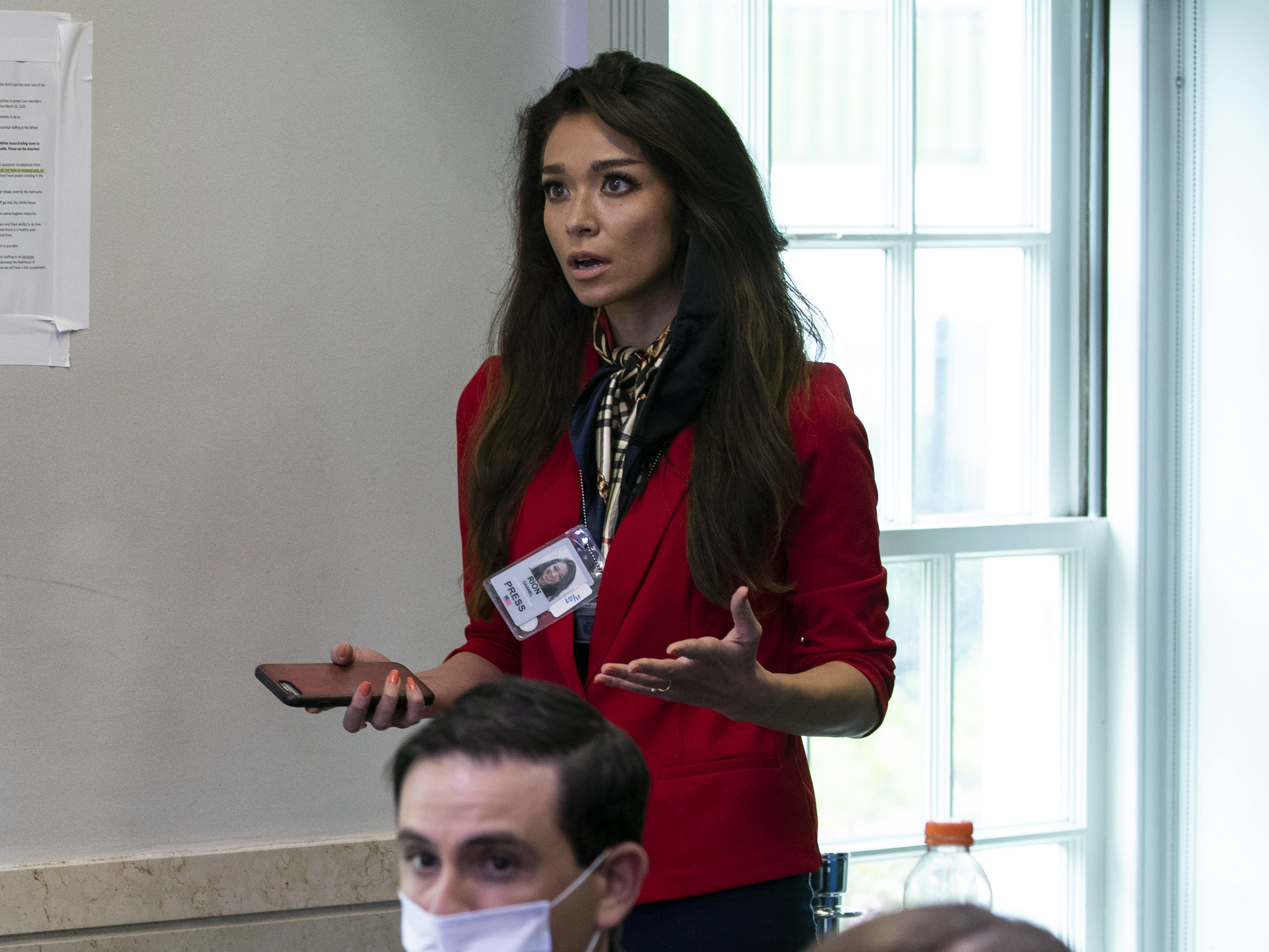 caption: One America News Network reporter Chanel Rion asks a question at a briefing for reporters at the White House on May 22, 2020.